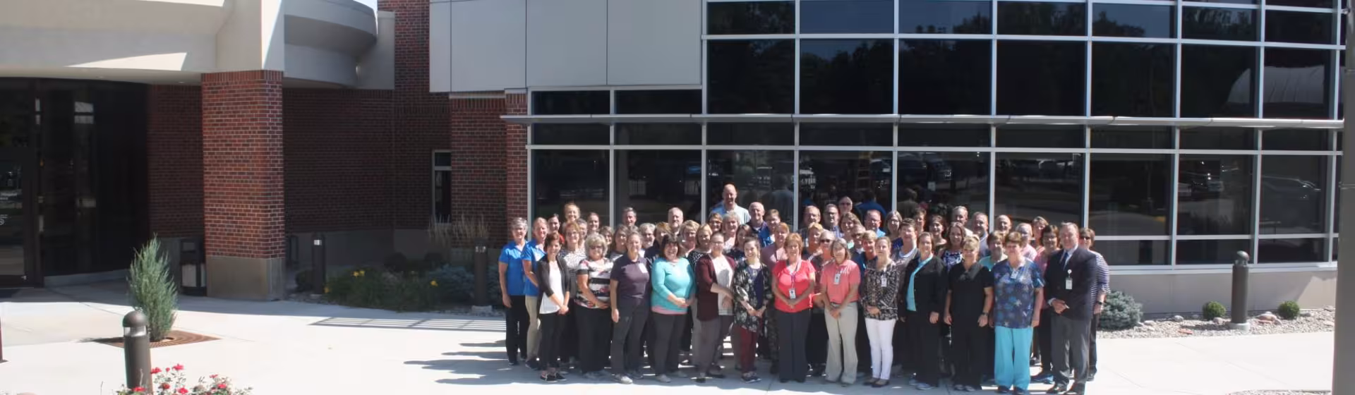 staff group front of hospital