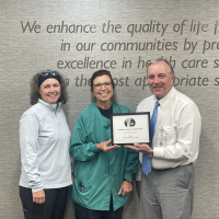 Picture Lynette Pallas with CEO Roger Reamer and Supervisor Brenda Smith