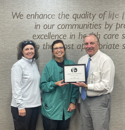 Picture Lynette Pallas with CEO Roger Reamer and Supervisor Brenda Smith